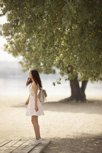 istock Young Woman on the Beach in Summer 1164658401