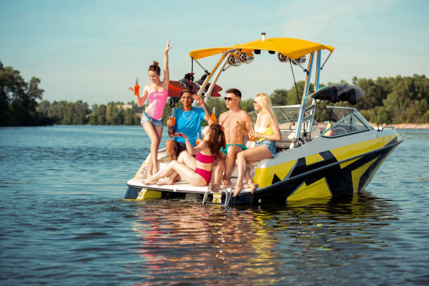 istock Cheerful people having a good time on a yacht 1164660043