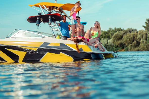 istock Carefree young people having a party on a boat 1164660050