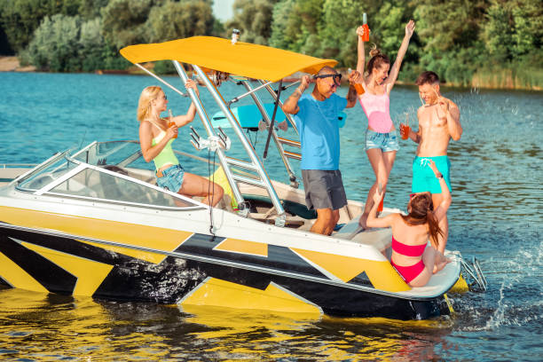 istock Hilarious multiracial friends having fun on the river 1164660052