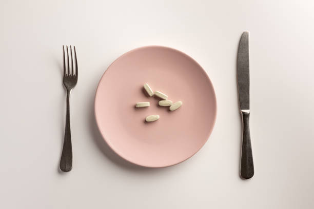 istock Dietary supplements on the plate. Flat lay. 1164660773