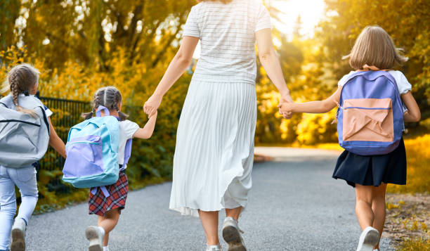 istock Parent and pupils go to school 1164664503