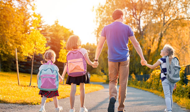 istock Parent and pupils go to school 1164664540