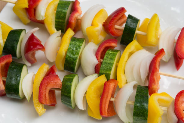 fresh raw vegetables on sticks for grill closeup