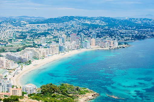 The beautiful view from famous rock Penon de Ifach of at Costa Blanca to the shore of the city Calpe, Spain.