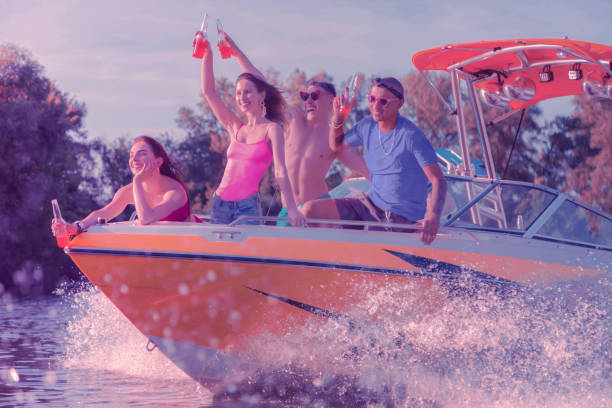 istock Cheerful people drinking soft drinks on a yacht 1164665538