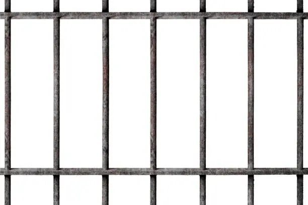 Photo of Old prison rusted metal bars cell lock isolated on white background