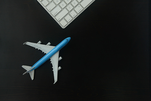 Close-up of model aeroplane & computer keyboard