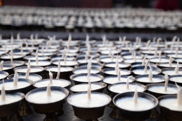 istock White Candles background.Buddhism Candles in a row.Buddhism praying ceremony 1164668640