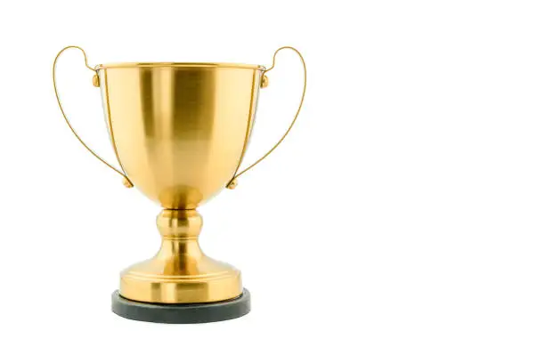 Photo of Brass steel trophy, dual handle neo-classic, isolated on white. Trophy is a tangible, durable reminder of a specific achievement, serves as recognition / evidence of merit, awarded for sporting events