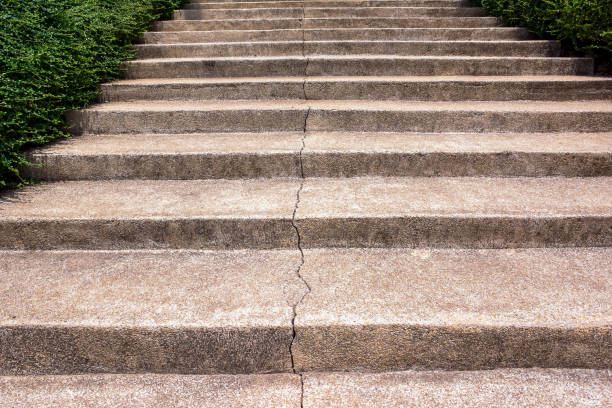 istock Concrete staircase cracked background. Broken stone staircase surface 1164671162