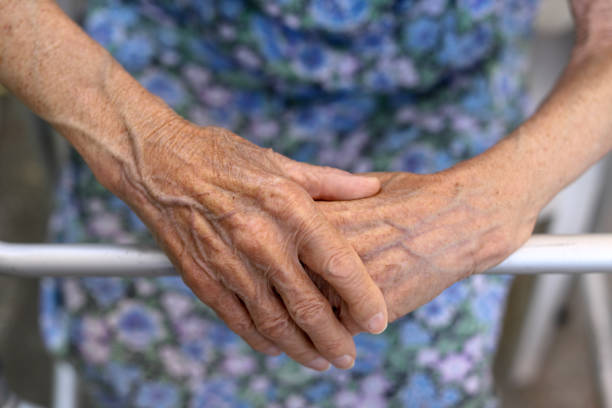 istock Old lady's hand. Elderly lady is waiting for help. Senior lady experiencing bad service and conditions in retirement nursing home.Elderly concept. Aging concept 1164672629