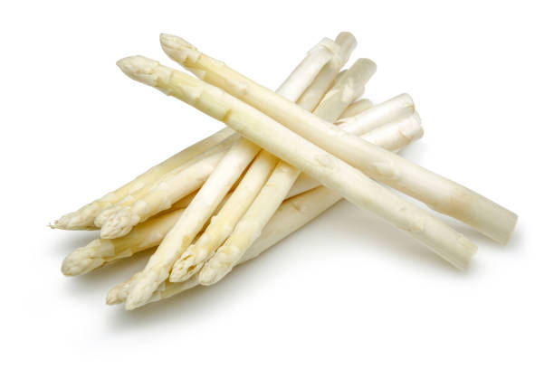 istock Bunch of white asparagus isolated on white 1164672681