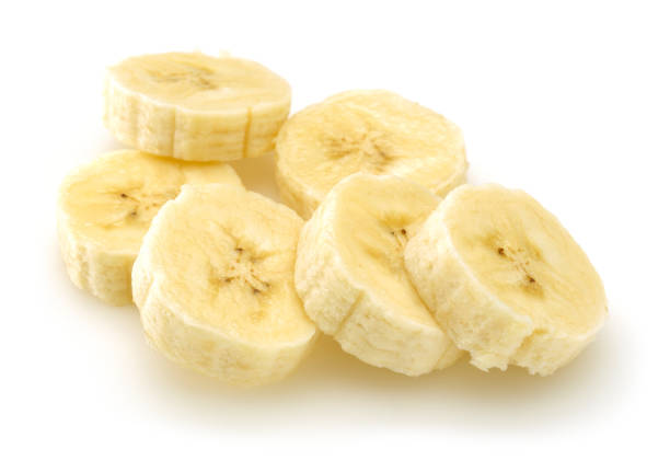 istock Sliced ripe banana isolated on white 1164673671