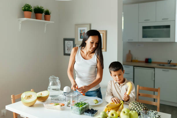 istock Mother and Son Making Smoothie 1164674606