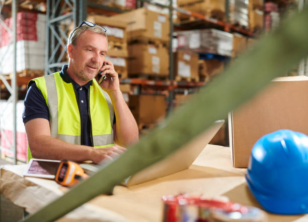 istock warehouse manager on the phone 1164675255