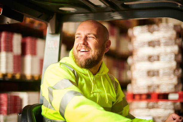 happy warehouse driver - warehouse forklift distribution warehouse merchandise imagens e fotografias de stock