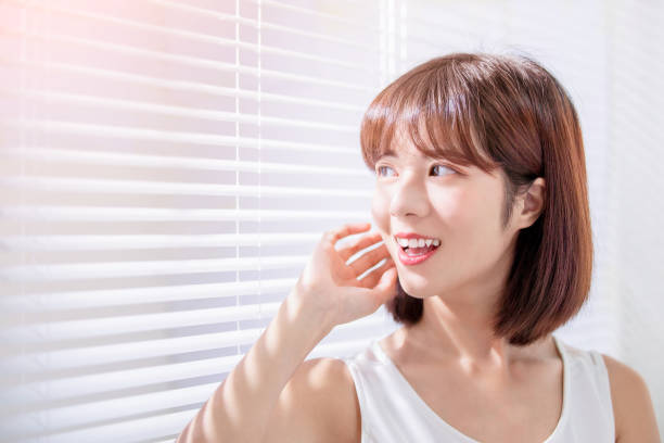 istock Young asian woman enjoy sunshine 1164676227
