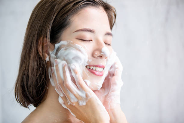 istock beauty woman clean her face 1164676297