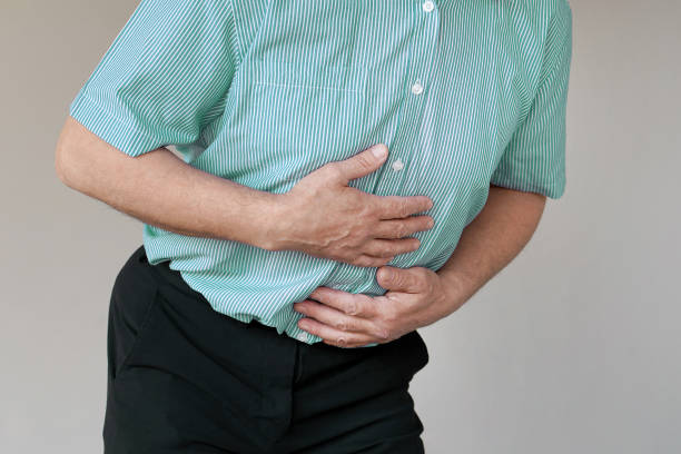 istock elderly man suffering from abdominal pain 1164677589