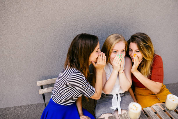 istock Friends enjoying coffee and conversation at cafe 1164678735