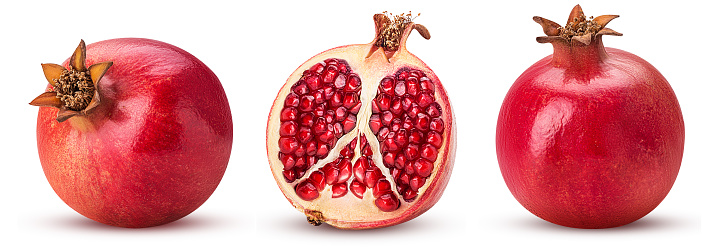 Set pomegranate whole, cut in half isolated on white background. Clipping Path. Full depth of field.