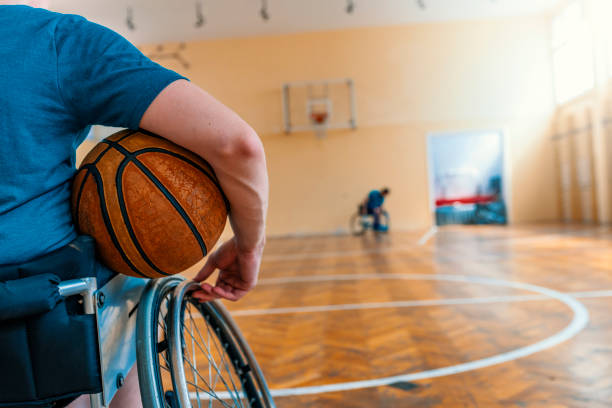 istock Disabled sport men relaxation while playing indoor basketball 1164682339