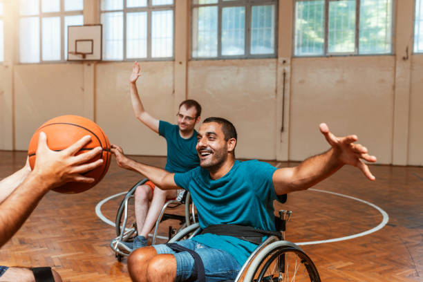 istock Disabled sport men in action playing basketball 1164682524
