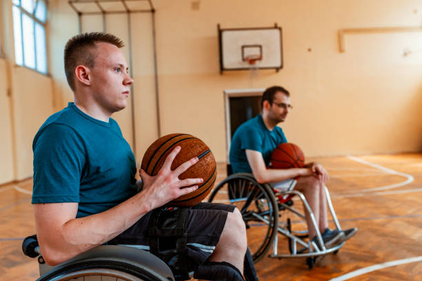istock Paraplegic basketball athlete playing training with his teammates 1164682845