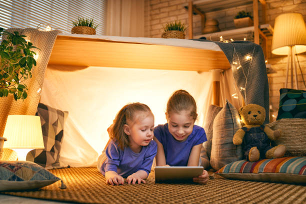 istock children are playing with tablet in tent 1164684649