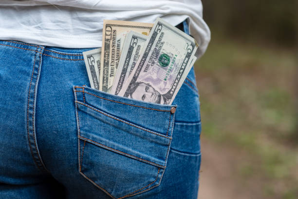 istock Money in rear jeans pocket 1164685241