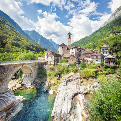 Summer classical alpine landscape of Lavertezzo village with Roman Bridge and Madonna degli Angeli Parish Church, Switzerland