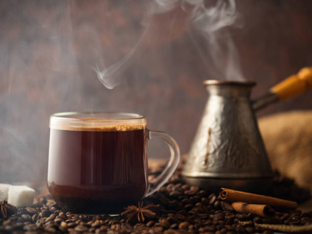 istock Espresso transparent glass Cup and coffee beans on the table . 1164685452