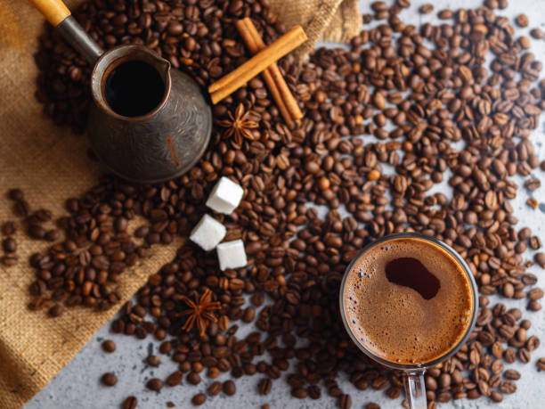istock Espresso transparent glass Cup and coffee beans on the table . 1164685456