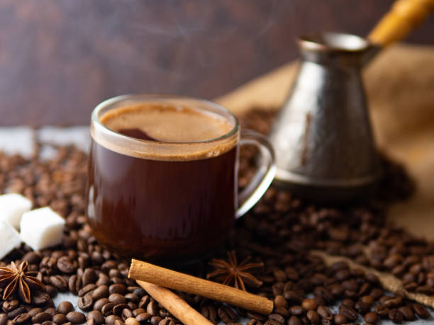 istock Espresso transparent glass Cup and coffee beans on the table . 1164685468