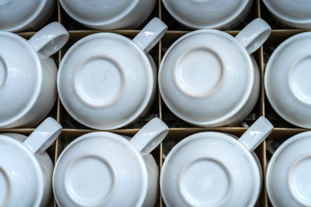 istock many of the same white mugs for drinks, coffee or tea. stand upside down in a drawer 1164686448