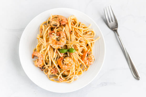 Shrimp Spaghetti Pasta on White Background Directly Above Photo stock photo