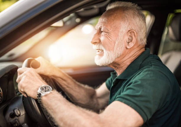 istock Angry senior man driving a car. 1164689303