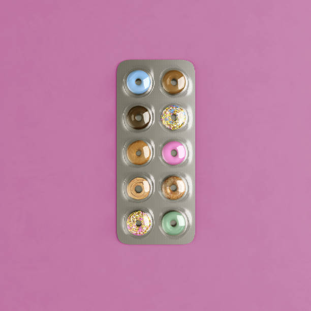 istock Blister pills diet concept and open box of pills. Donuts sweets idea. 1164690095