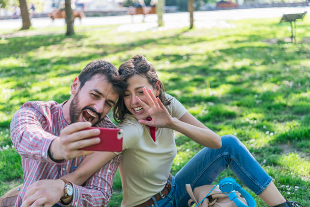 istock Young Attractive Couple is Having Fun in the Public Park 1164691424