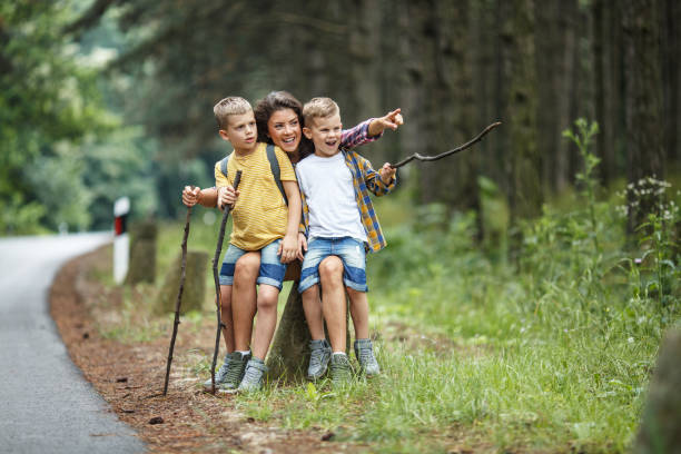 istock Mother and her little sons hiking . 1164691803