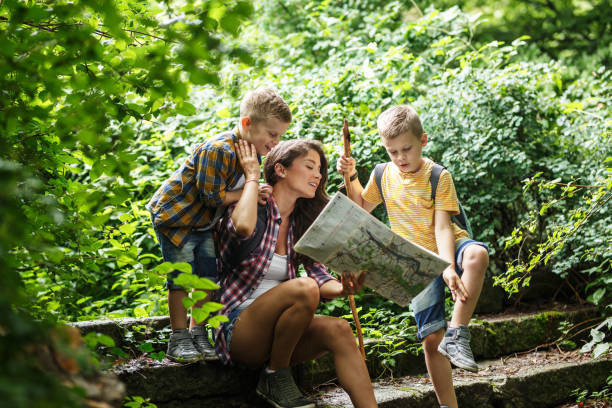 istock Mother and her little sons hiking . 1164692126