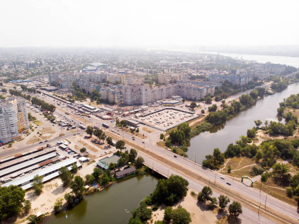 Aerial photography of a cityscape with a river with bridge, a road and a buildings. Drone aerial photography of a beautiful cityscape with a river with bridge, a road and a buildings. filming point of view highway day road stock pictures, royalty-free photos & images