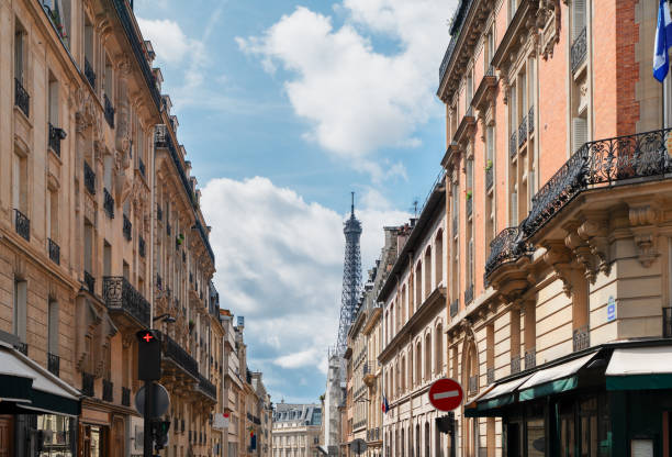 istock eiffel tour and Paris street 1164699115