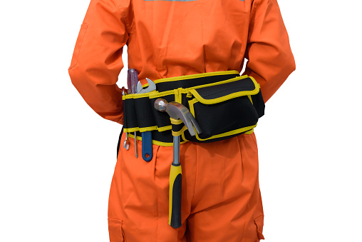 Closeup view of construction woman workers wearing Orange Protective clothes, helmet smiling with tool belt isolated on white background with clipping path