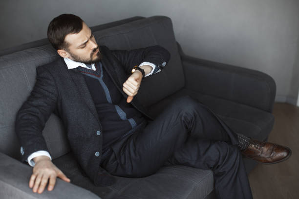 istock Worried Man with Watch 1164701834
