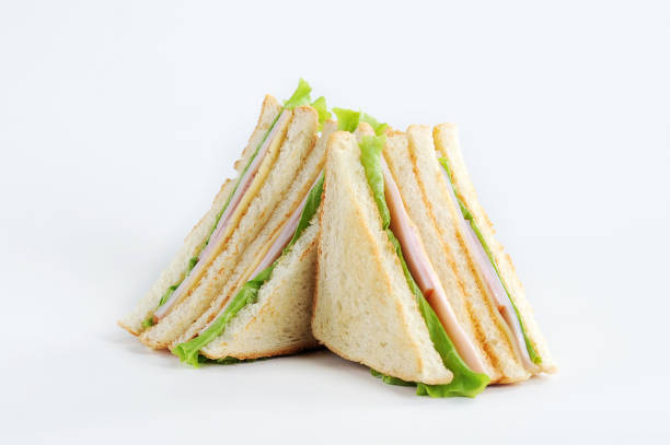club-sandwich mit käse und party auf weißem hintergrund. nahaufnahme. - breakfast close up vegetarian food nature stock-fotos und bilder