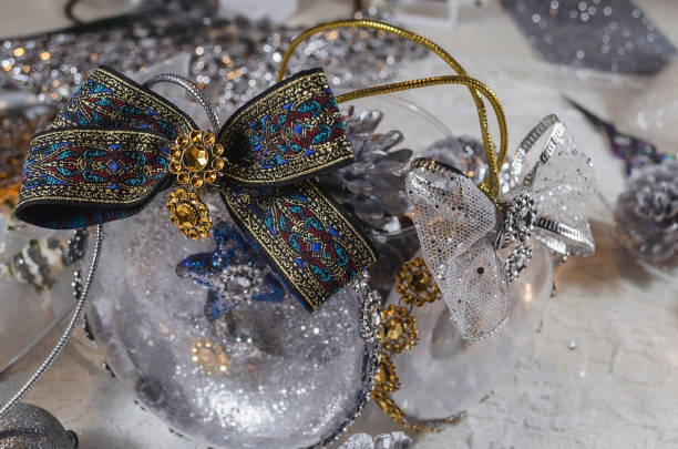 istock transparent christmas balls snowed inside and with a star inside decorated with a gold and silver bow 1164702917