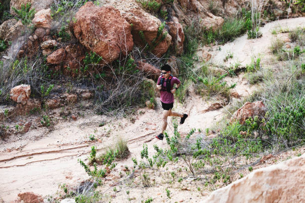 istock man running on the rocky road 1164703003