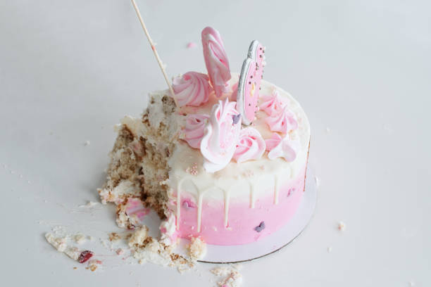 first birthday orenburg, russia, 05.04.2019. a little girl in a diaper huggies celebrates her birthday and broke a pink cake. - little cakes imagens e fotografias de stock